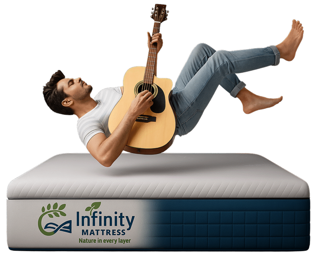 Young man relaxing and playing guitar on Infinity Mattress, showcasing comfort and support of India's Best Mattress.